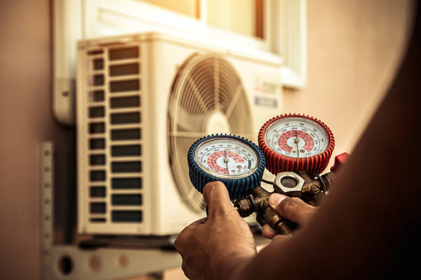 Professional Heat Pump Repair technician working in Raymond, OH